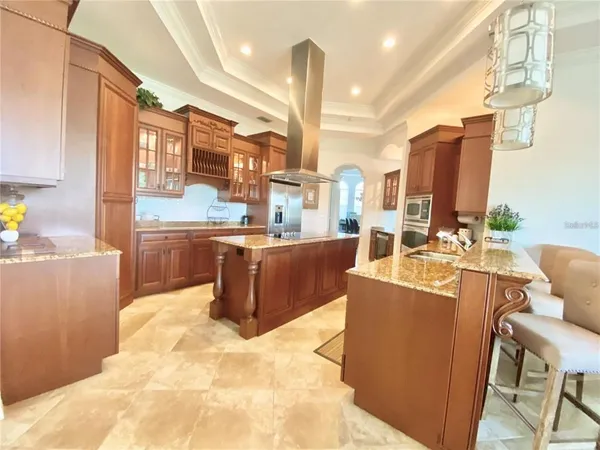 a living room with large window and furniture