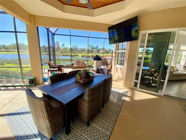 a bedroom with a bed dresser and a flat tv screen