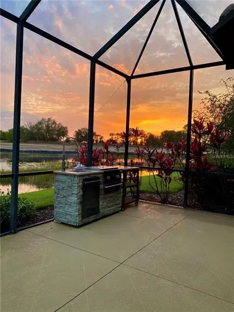 a bed room with a bed and a chair