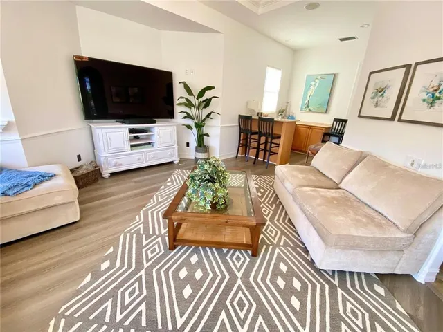 a bed sitting in a bedroom next to a large window