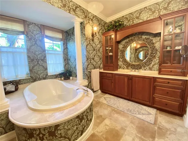 a utility room with a sink and cabinets