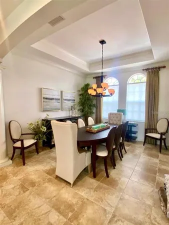 a kitchen with stainless steel appliances granite countertop a sink a stove and a wooden cabinets