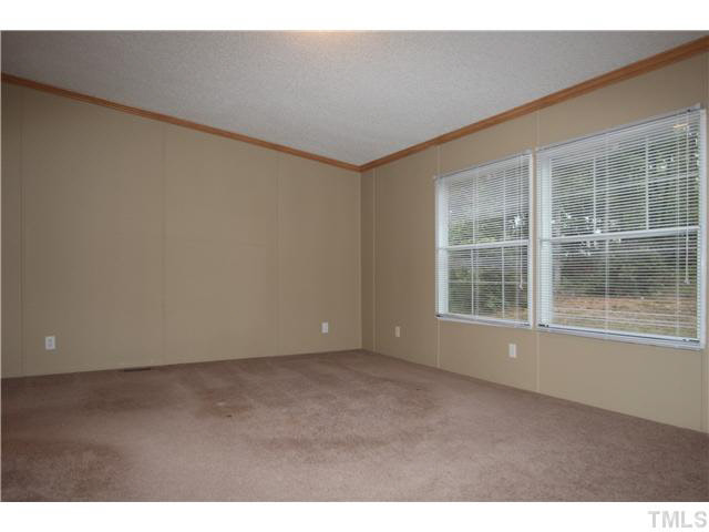 214 Jb Lane Roxboro, NC 27574 - Photo 8 of 16 Master bedroom with walk-in closet