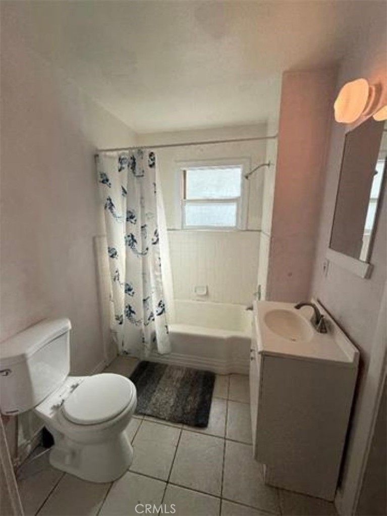 1517 Tehama Street Corning, CA 96021 - Photo 6 of 7 a bathroom with a sink a toilet and shower