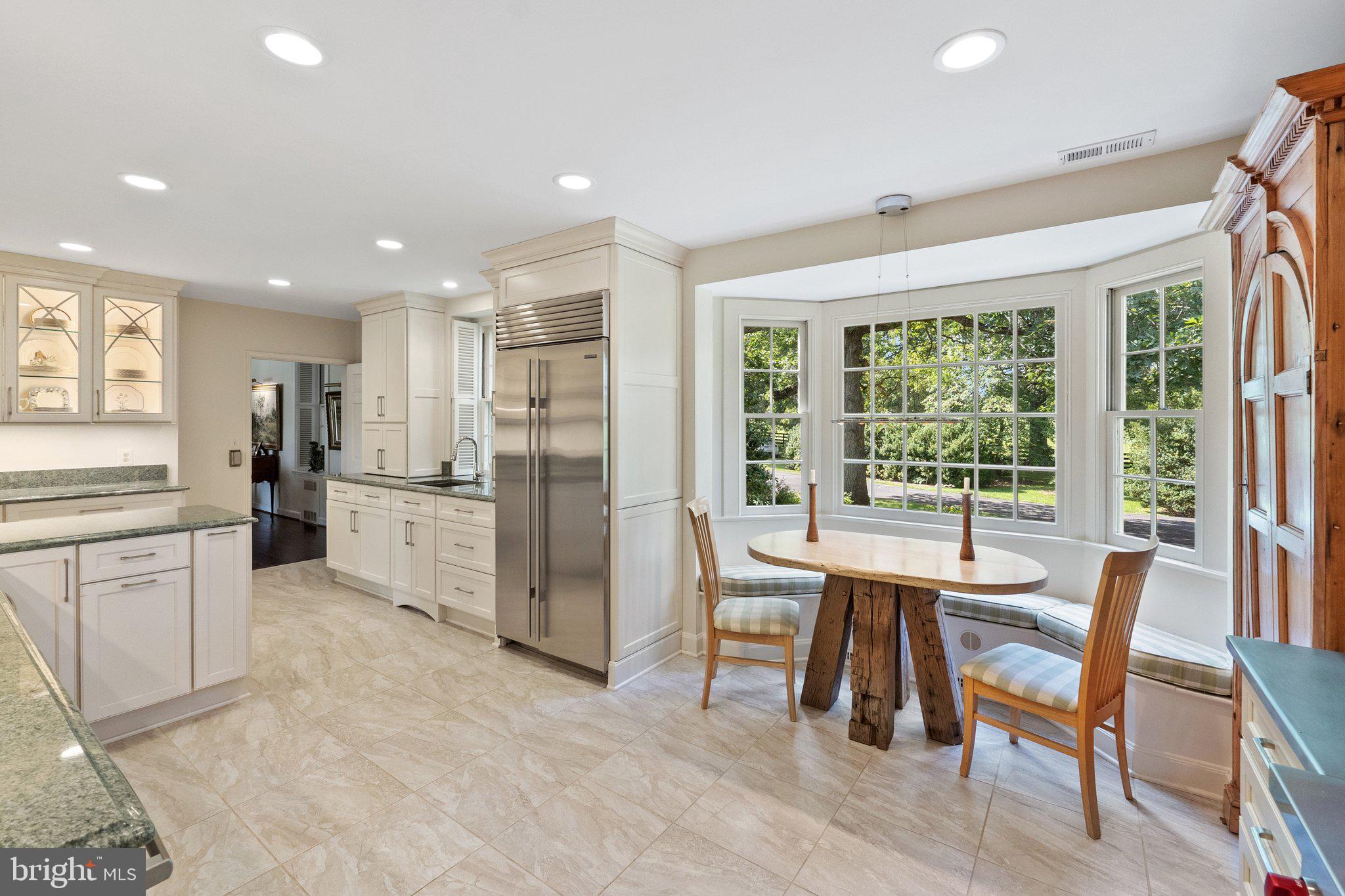 2573 Zulla Road The Plains, VA 20198 - Photo 20 of 81 a kitchen with a table chairs refrigerator and cabinets