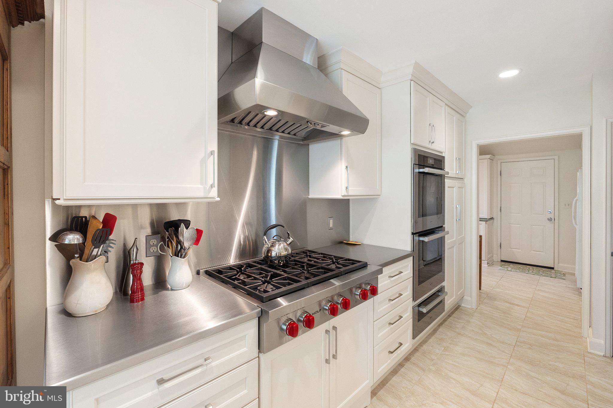 2573 Zulla Road The Plains, VA 20198 - Photo 22 of 81 a kitchen with stainless steel appliances granite countertop a stove and a refrigerator