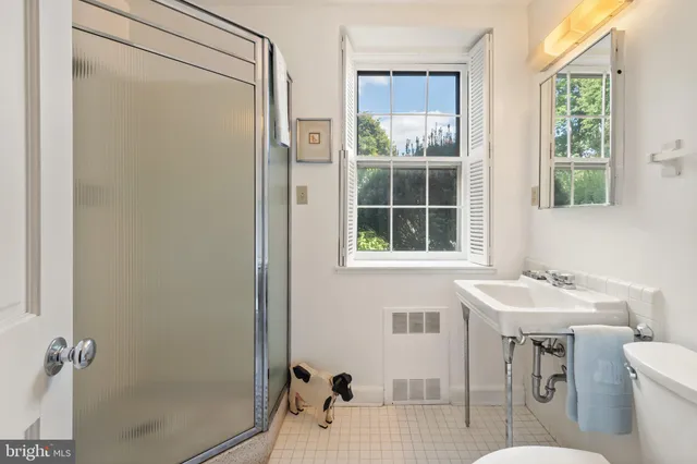 a aerial view of a house with a yard table and chairs