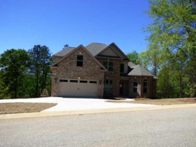 211 Timber Ridge Boulevard Byron, GA 31008 - Photo 2 of 31 a front view of a house with a yard
