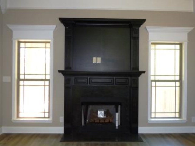 211 Timber Ridge Boulevard Byron, GA 31008 - Photo 15 of 31 a living room with a fireplace and windows