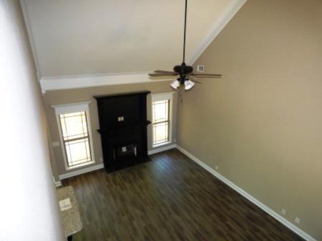 211 Timber Ridge Boulevard Byron, GA 31008 - Photo 23 of 31 a view of an empty room with a window and wooden floor