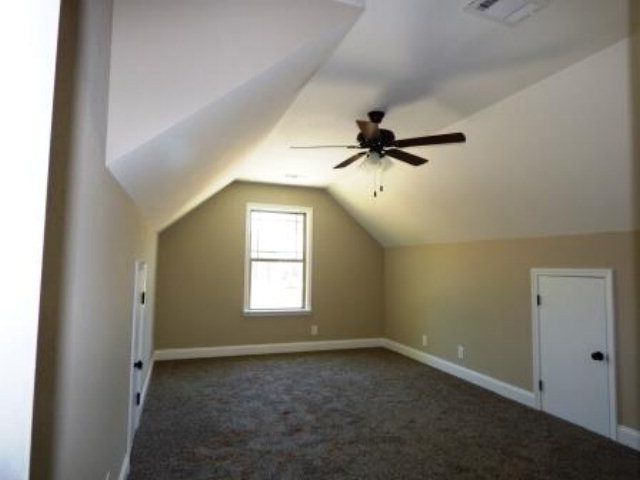 211 Timber Ridge Boulevard Byron, GA 31008 - Photo 27 of 31 an empty room with a window and a fan