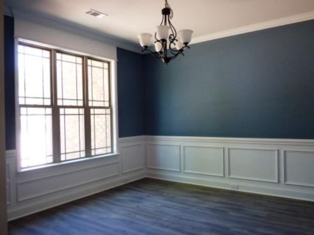 211 Timber Ridge Boulevard Byron, GA 31008 - Photo 4 of 31 a view of an empty room with wooden floor and a window
