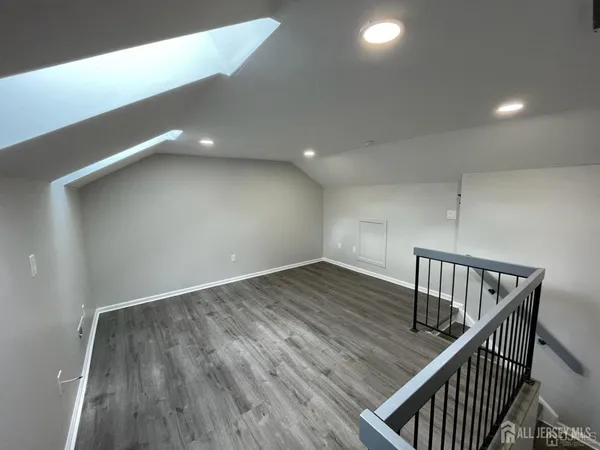 a view of room with wooden floor