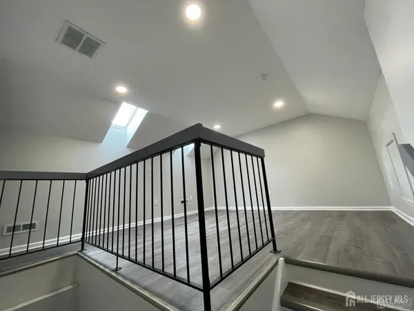 a view of a hallway with staircase