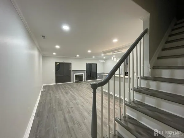a view of staircase with wooden floor and stairs