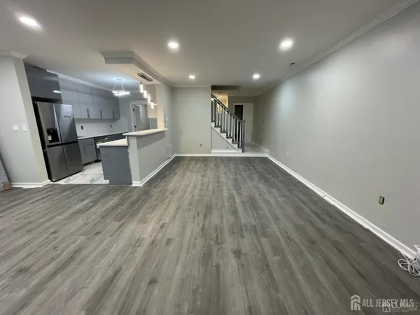 a view of kitchen with cabinets
