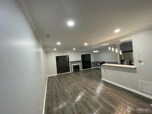 a view of a big room with wooden floor