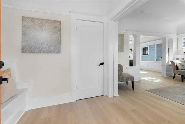 a living room with furniture and a painting on the wall