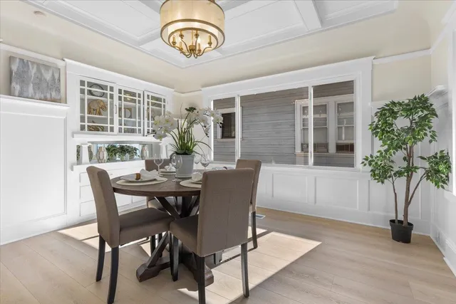 a view of a dining room with furniture window and wooden floor