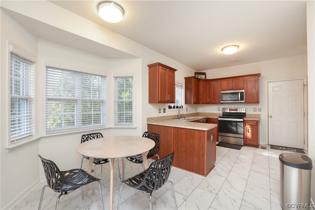1600 Winterfield Place Midlothian, VA 23113 - Photo 13 of 43 a kitchen with a stove a sink and a refrigerator