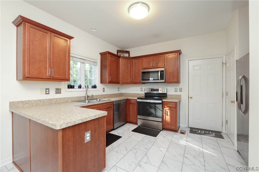1600 Winterfield Place Midlothian, VA 23113 - Photo 15 of 43 a kitchen with stainless steel appliances granite countertop a sink stove and refrigerator