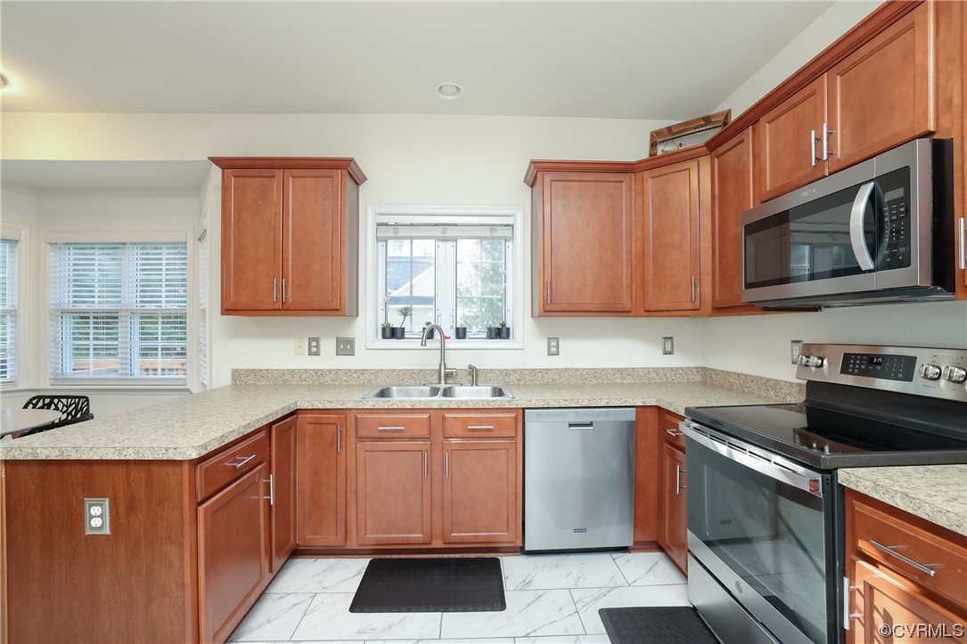 1600 Winterfield Place Midlothian, VA 23113 - Photo 16 of 43 a kitchen with stainless steel appliances granite countertop a sink stove microwave and cabinets