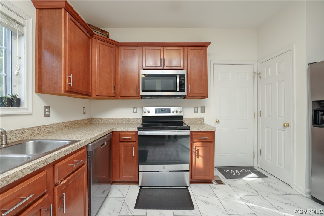 1600 Winterfield Place Midlothian, VA 23113 - Photo 18 of 43 a kitchen with granite countertop a stove and a sink