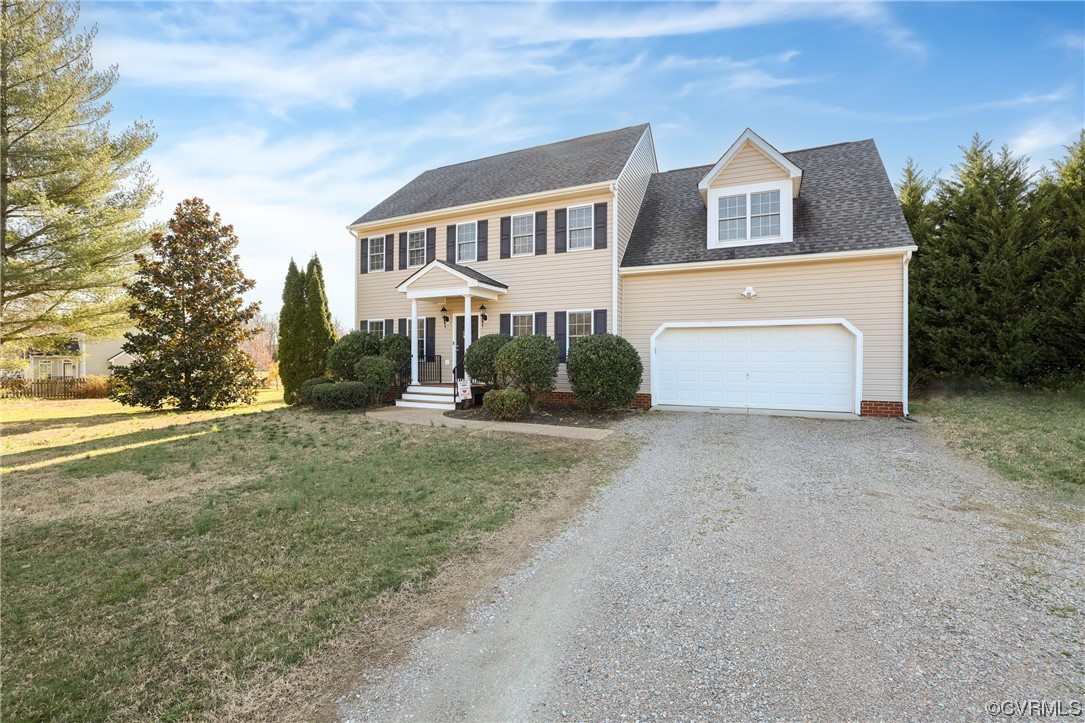 1600 Winterfield Place Midlothian, VA 23113 - Photo 2 of 43 a front view of a house with a yard and garage