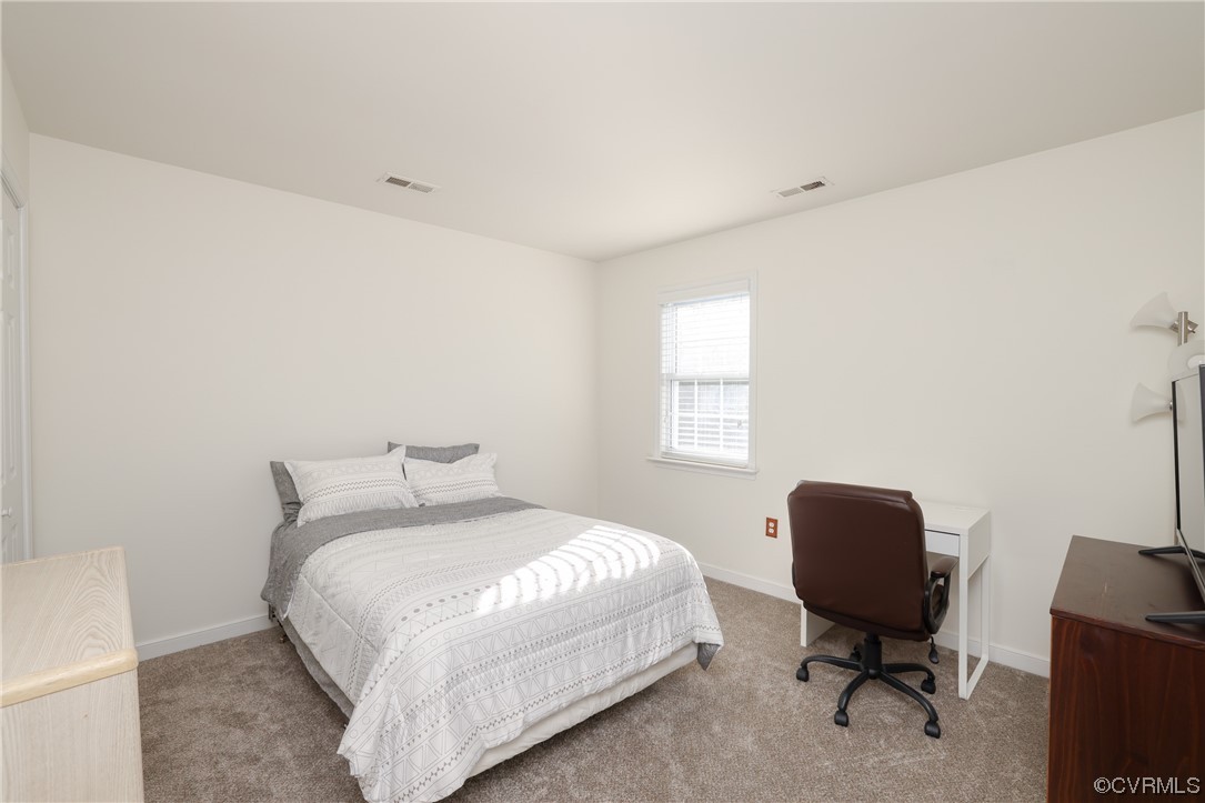 1600 Winterfield Place Midlothian, VA 23113 - Photo 22 of 43 a bedroom with a bed a chair and a window