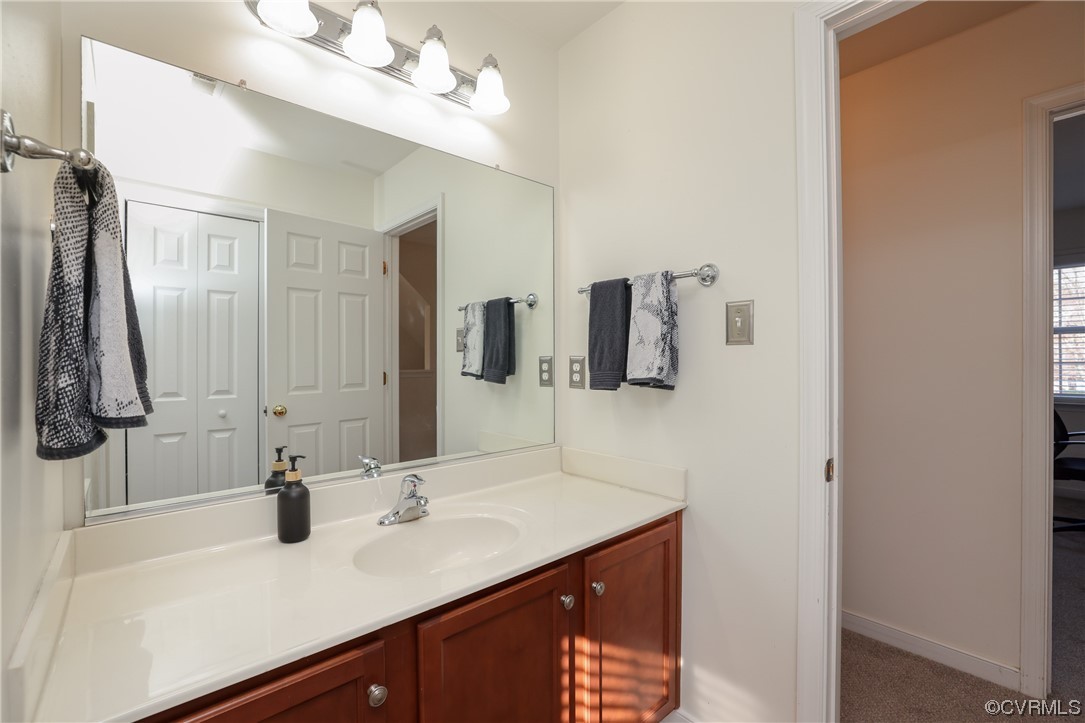 1600 Winterfield Place Midlothian, VA 23113 - Photo 25 of 43 a bathroom with a sink vanity and a mirror