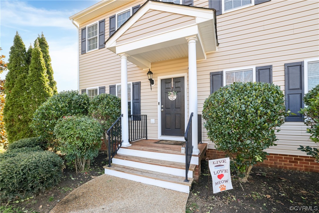 1600 Winterfield Place Midlothian, VA 23113 - Photo 3 of 43 a front view of a house with a yard and trees