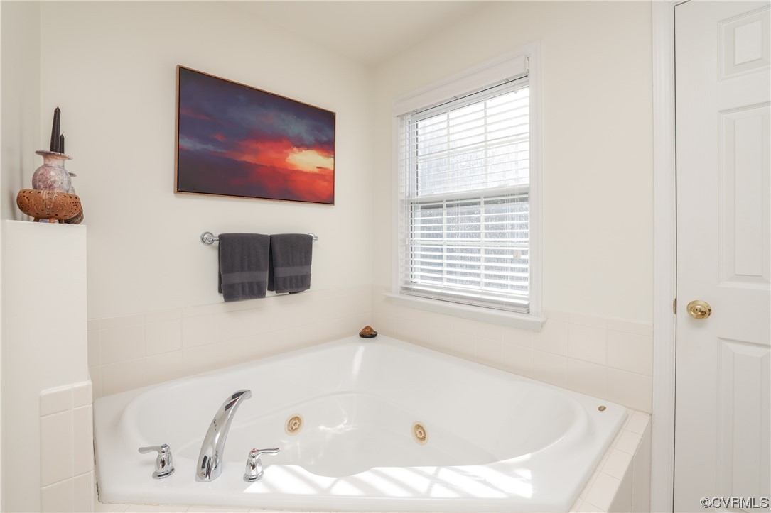 1600 Winterfield Place Midlothian, VA 23113 - Photo 36 of 43 a bathroom with a tub sink and mirror