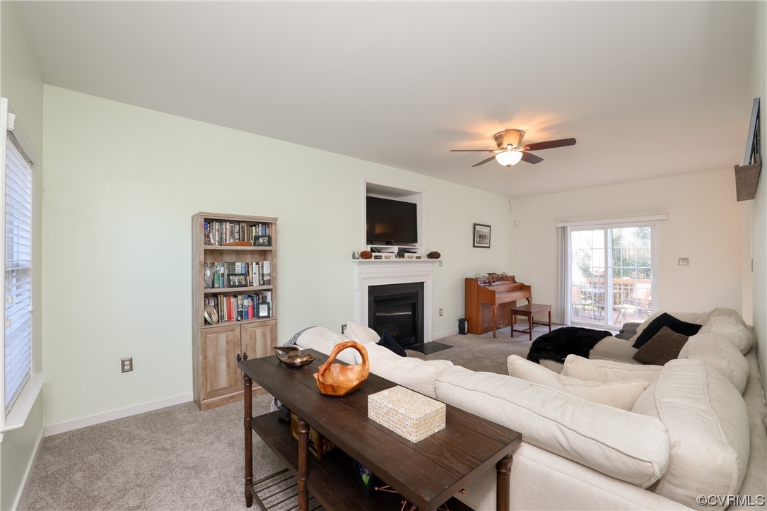 1600 Winterfield Place Midlothian, VA 23113 - Photo 8 of 43 a living room with furniture a fireplace and a flat screen tv