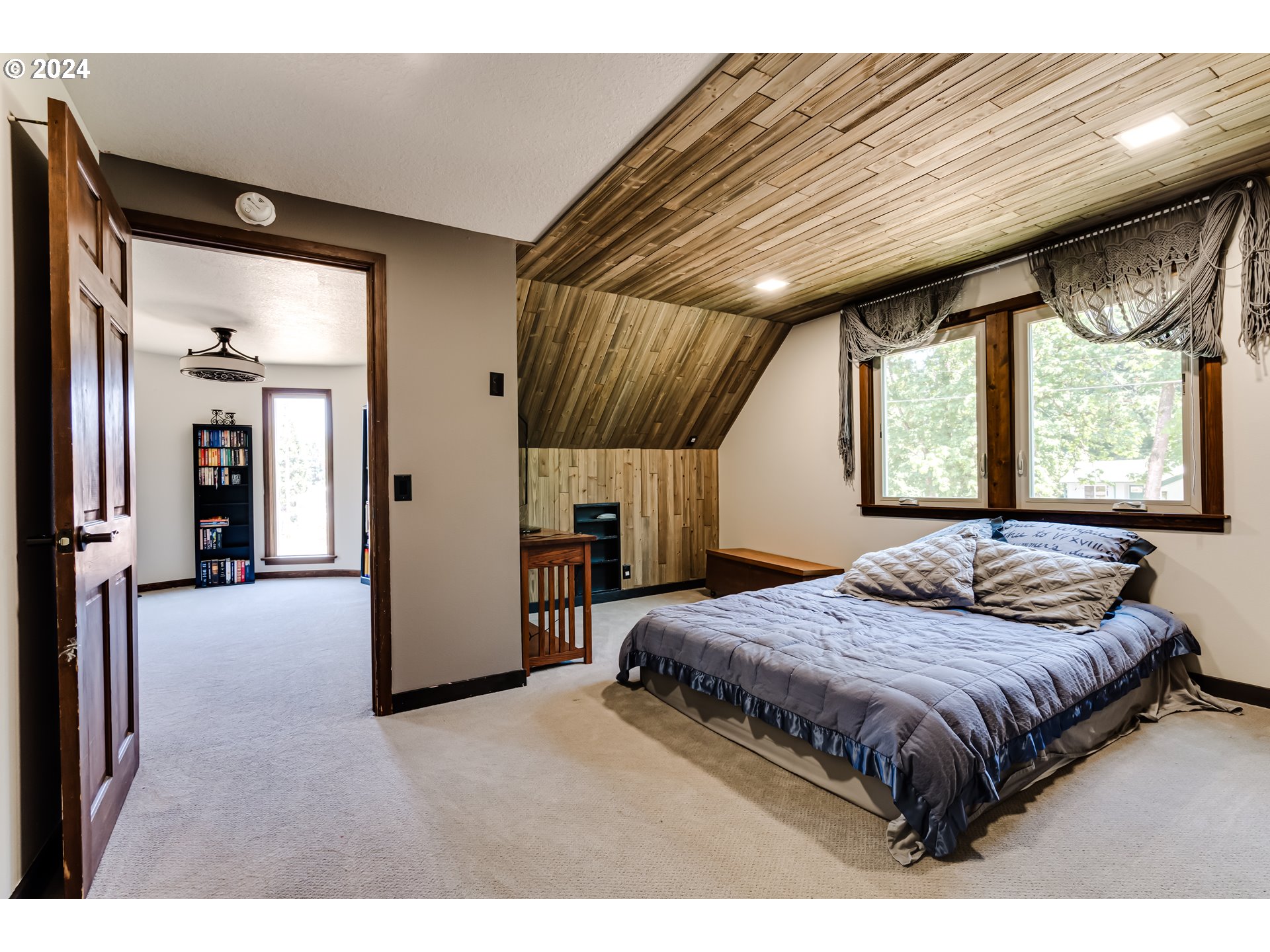 37198 Wheeler Road Pleasant Hill, OR 97455 - Photo 31 of 46 a bedroom with a large bed and a window