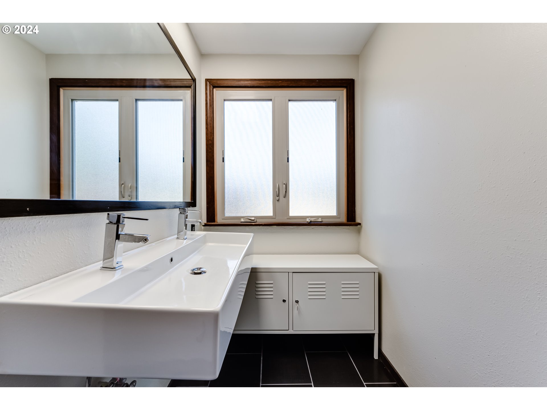 37198 Wheeler Road Pleasant Hill, OR 97455 - Photo 36 of 46 a bathroom with a sink a mirror and a window