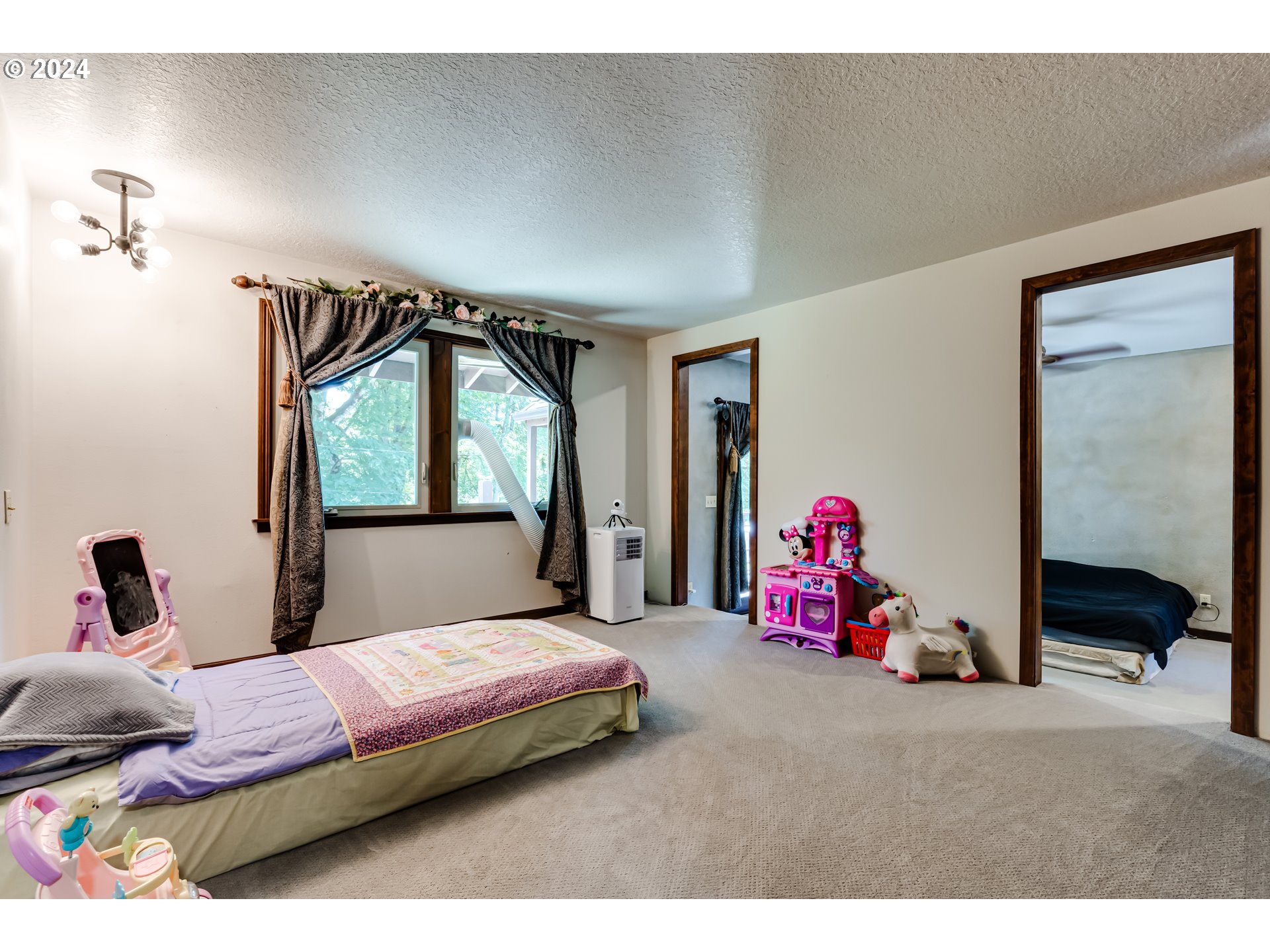 37198 Wheeler Road Pleasant Hill, OR 97455 - Photo 38 of 46 a bedroom with a bed and a large mirror