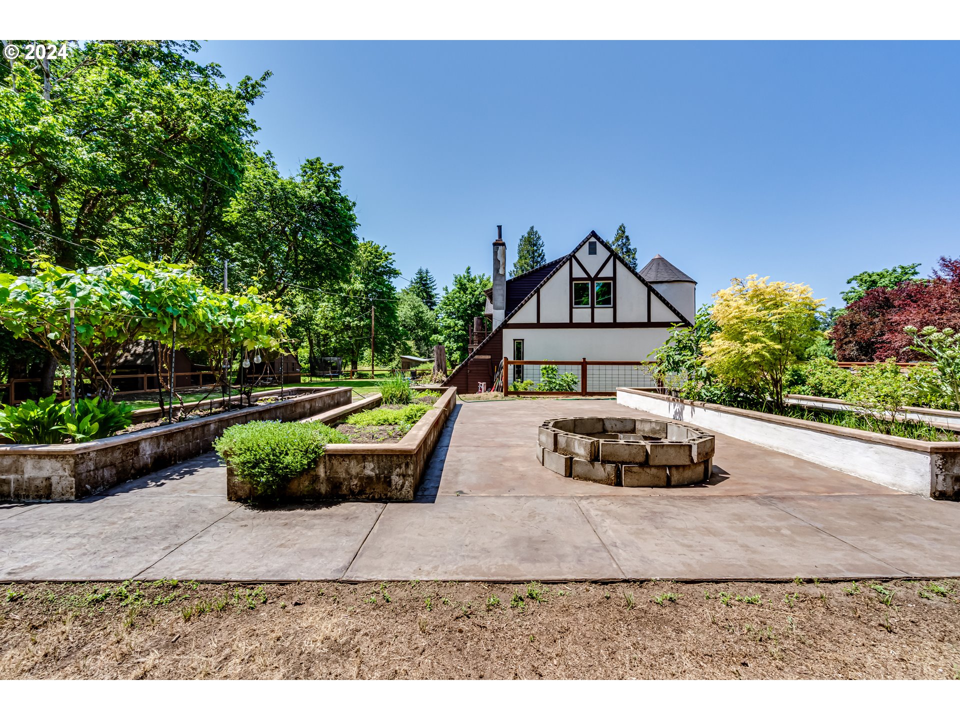 37198 Wheeler Road Pleasant Hill, OR 97455 - Photo 45 of 46 a view of a house with a yard and potted plants