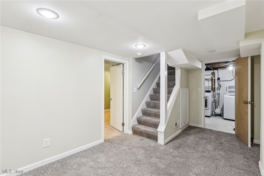 1573 Roselawn Road Cleveland, OH 44124 - Photo 20 of 25 Basement with light colored carpet and washer and dryer