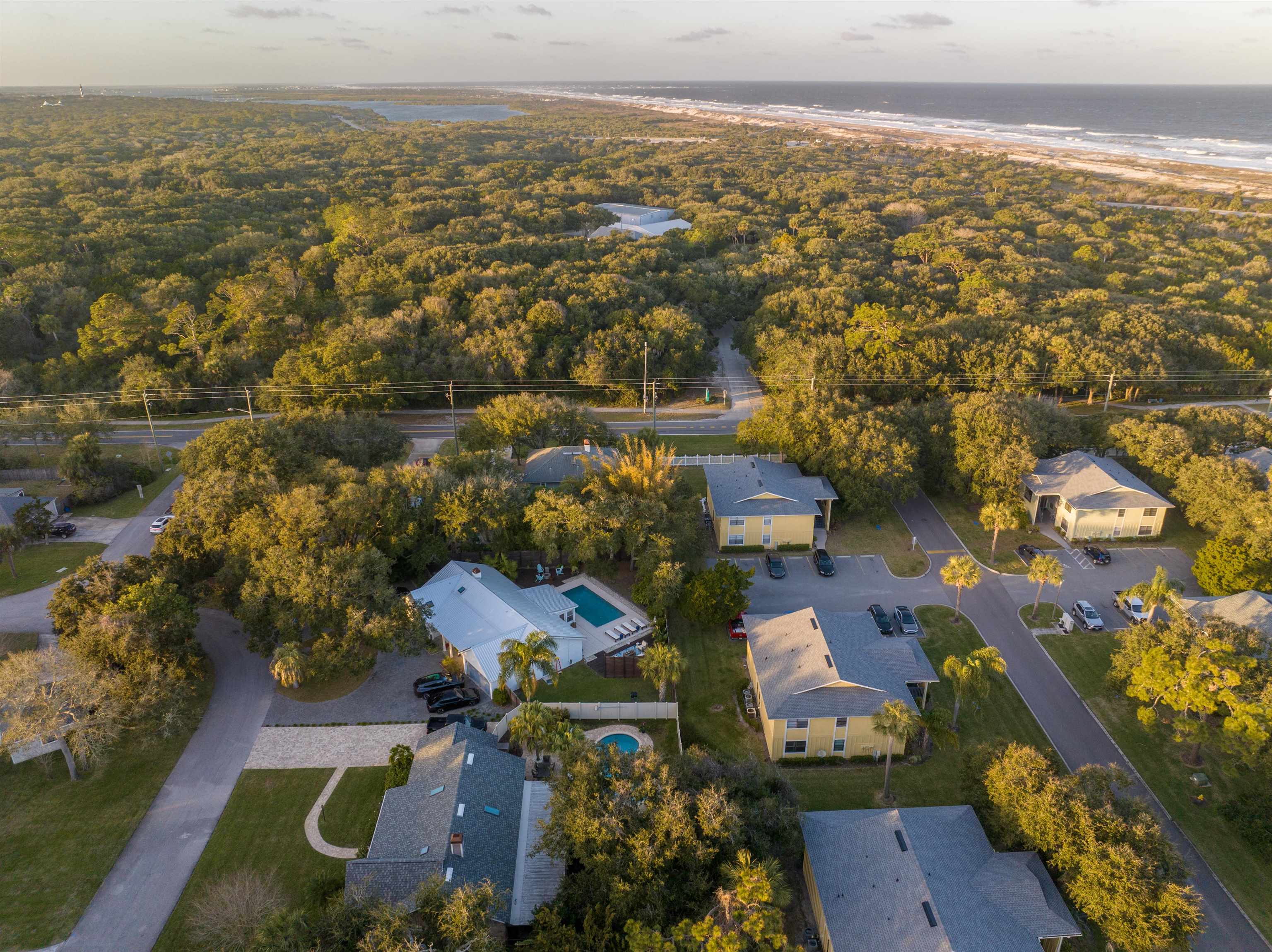 an aerial view of residential building and lake