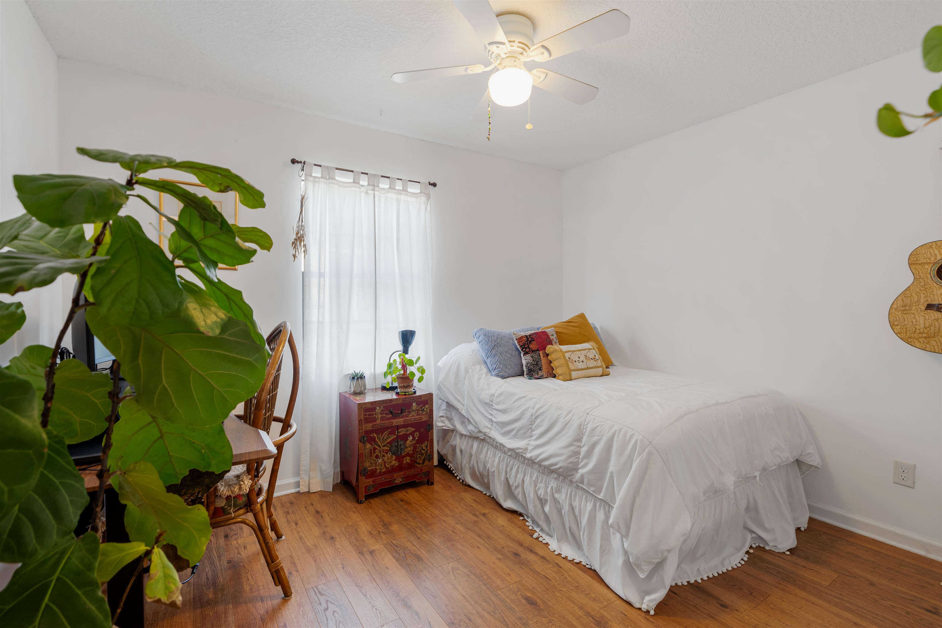 10 Brigantine Court St. Augustine, FL 32080 - Photo 12 of 26 a bedroom with a bed table and a chandelier