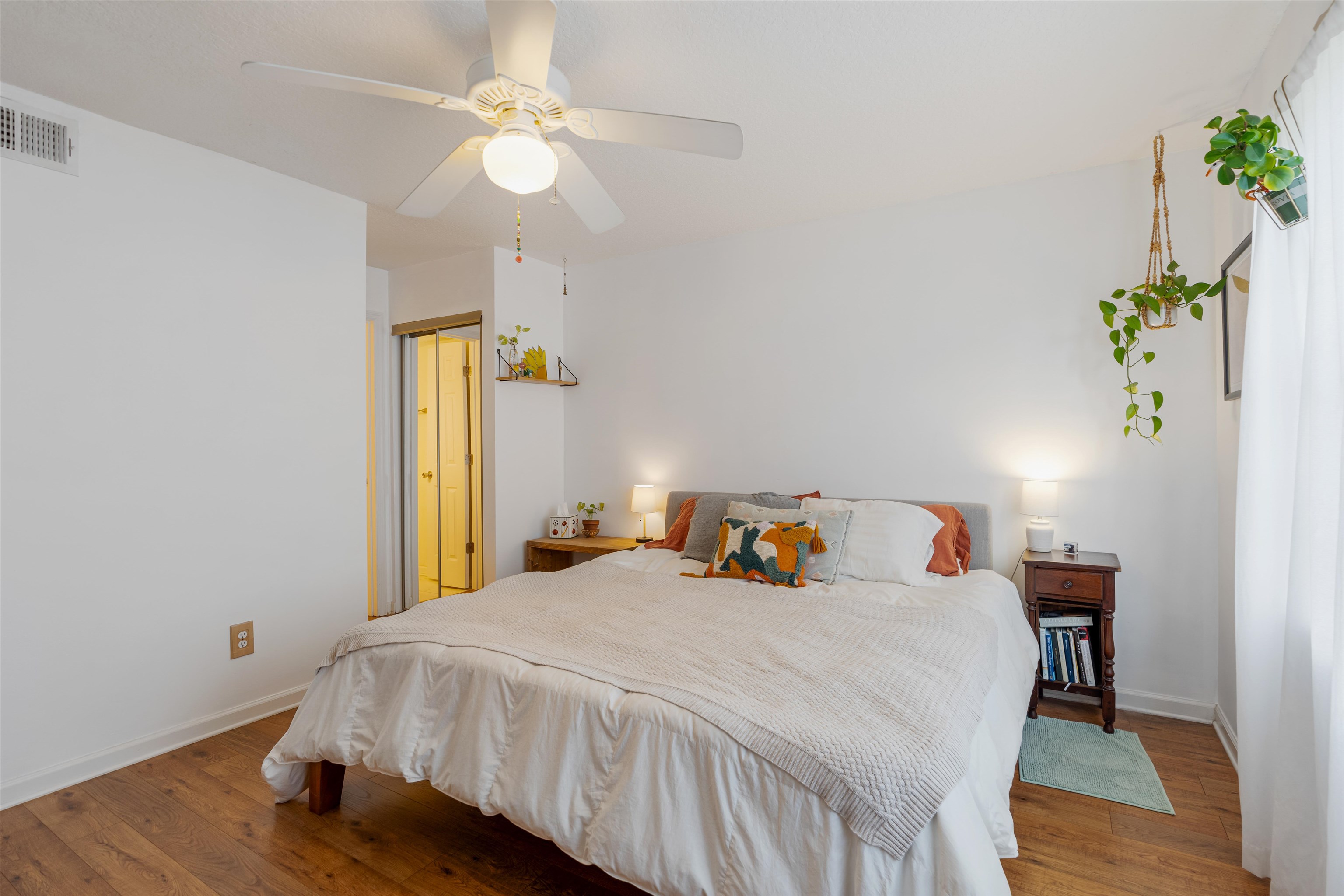 10 Brigantine Court St. Augustine, FL 32080 - Photo 13 of 26 a bedroom with a bed and a chandelier