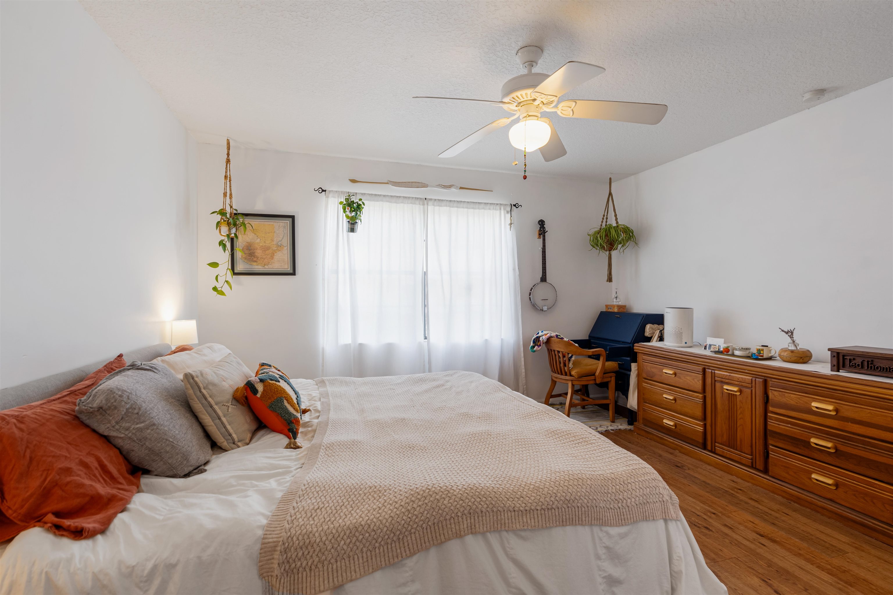 10 Brigantine Court St. Augustine, FL 32080 - Photo 14 of 26 a bedroom with a bed and a chandelier