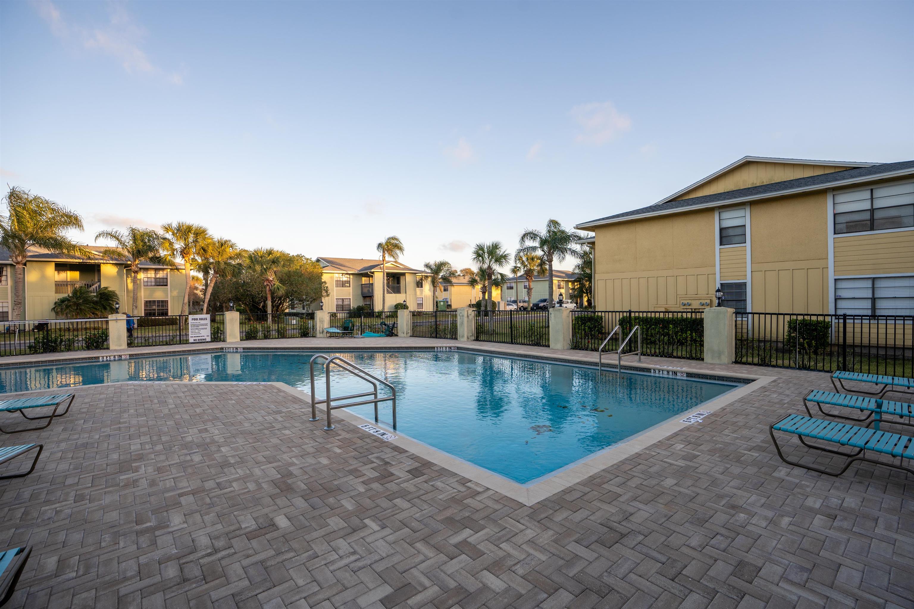 10 Brigantine Court St. Augustine, FL 32080 - Photo 20 of 26 a view of a swimming pool with outdoor seating and plants