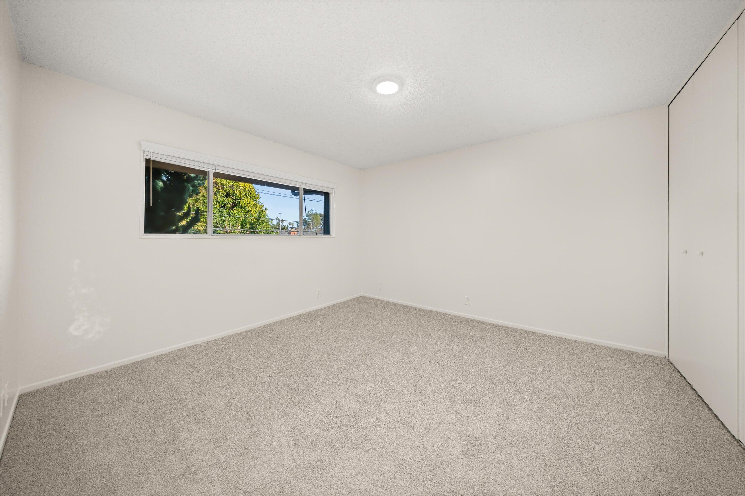 5722 Encina Road, Unit 4 Goleta, CA 93117 - Photo 13 of 28 an empty room with windows