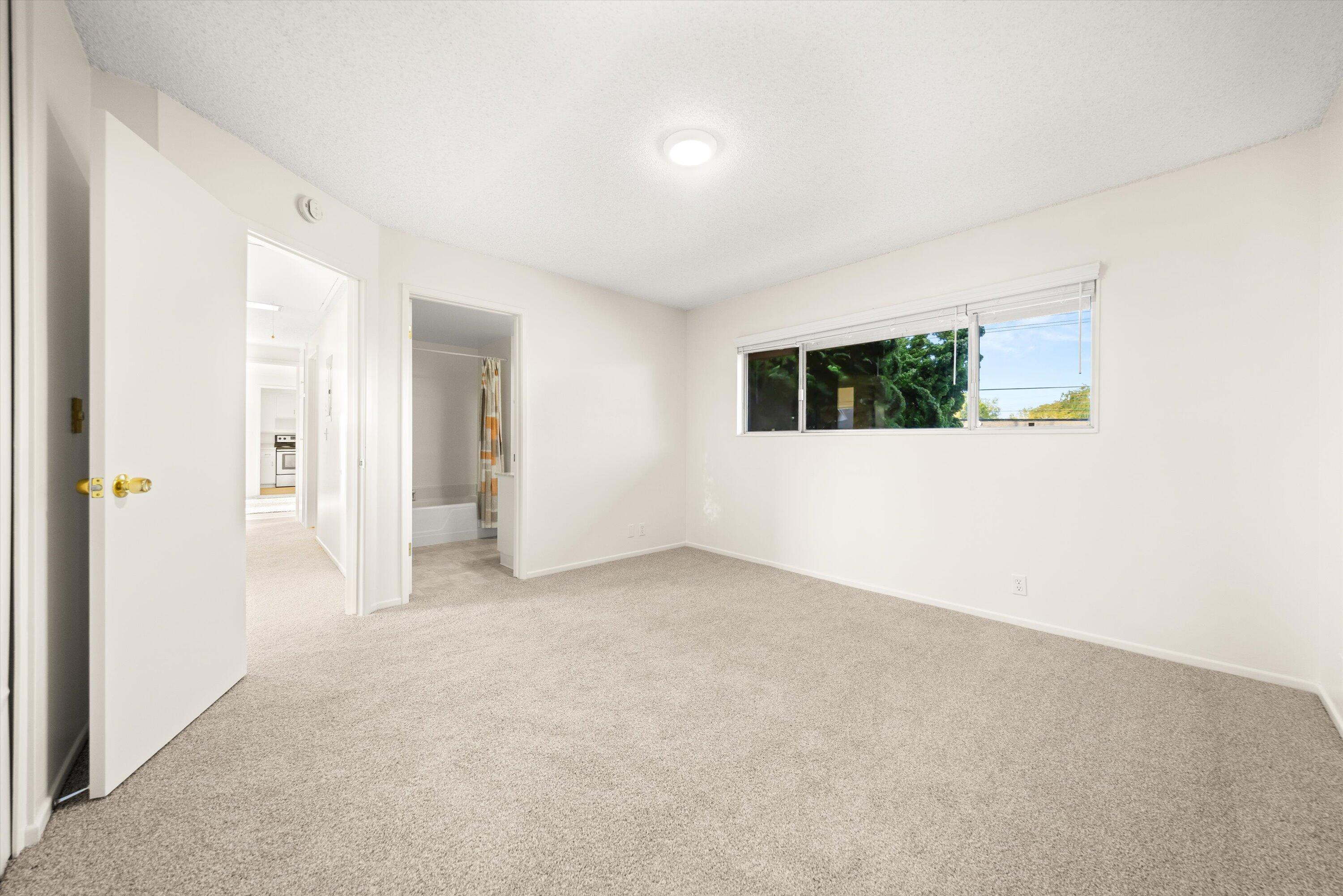 5722 Encina Road, Unit 4 Goleta, CA 93117 - Photo 14 of 28 an empty room with windows and closet