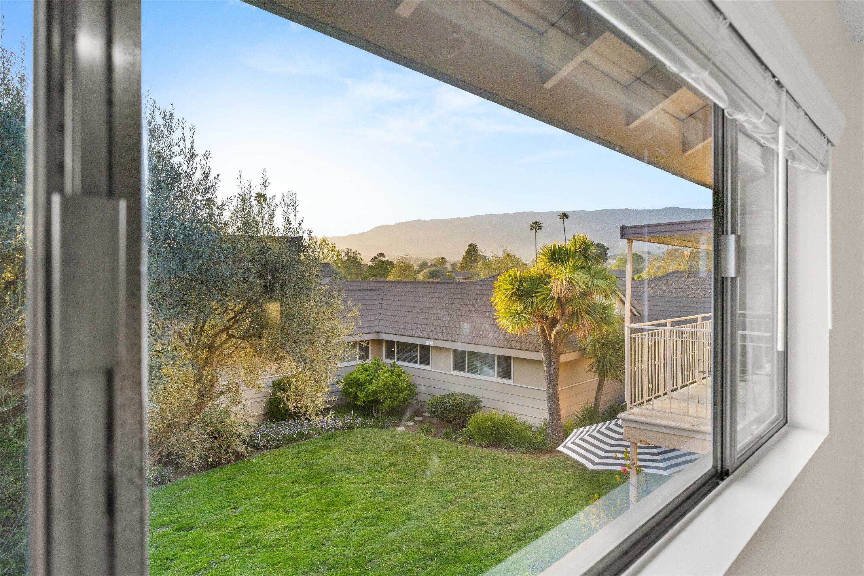 5722 Encina Road, Unit 4 Goleta, CA 93117 - Photo 20 of 28 a view of a back yard from a balcony