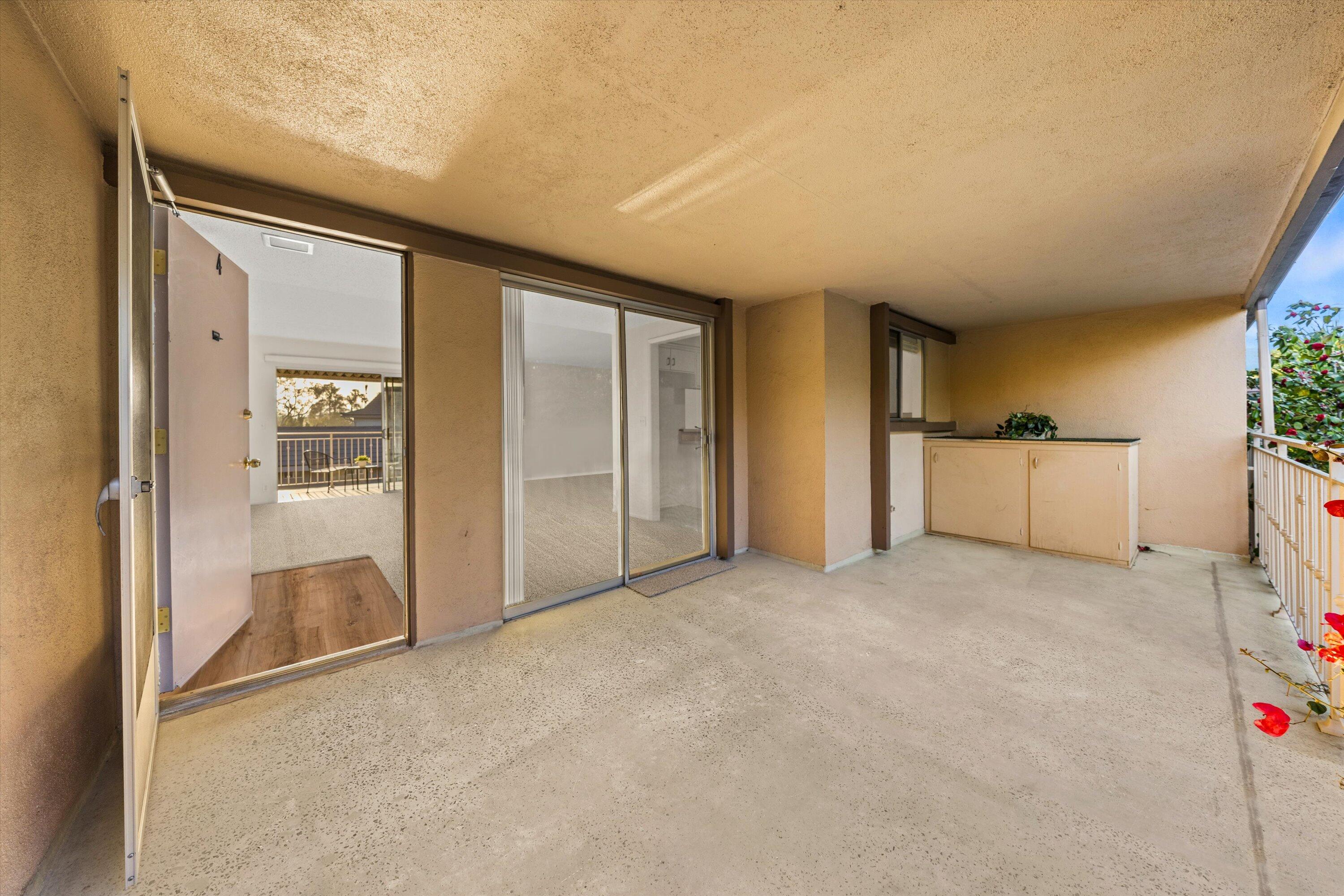 5722 Encina Road, Unit 4 Goleta, CA 93117 - Photo 3 of 28 an empty room with kitchen and windows