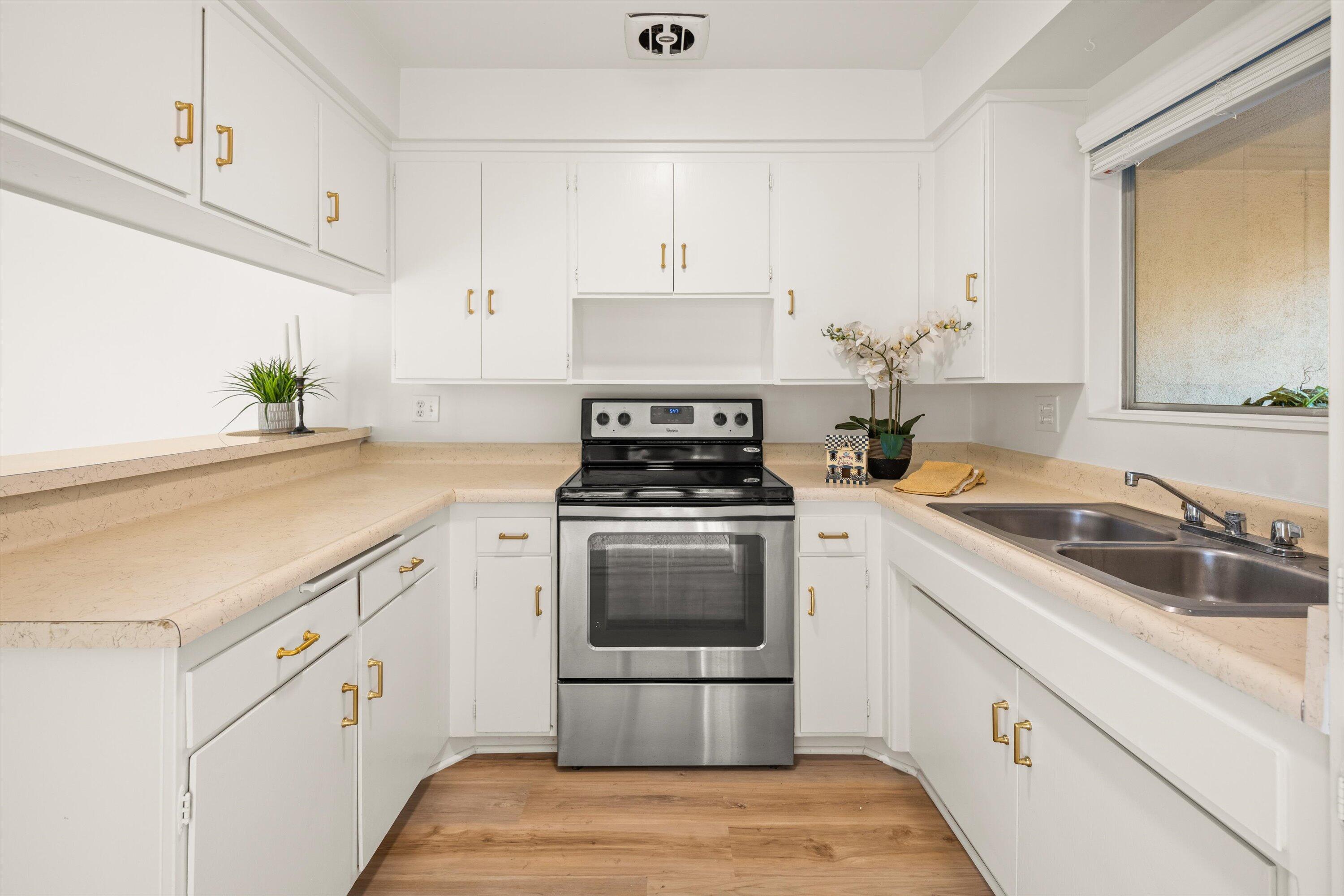 5722 Encina Road, Unit 4 Goleta, CA 93117 - Photo 8 of 28 a kitchen with cabinets appliances and a sink