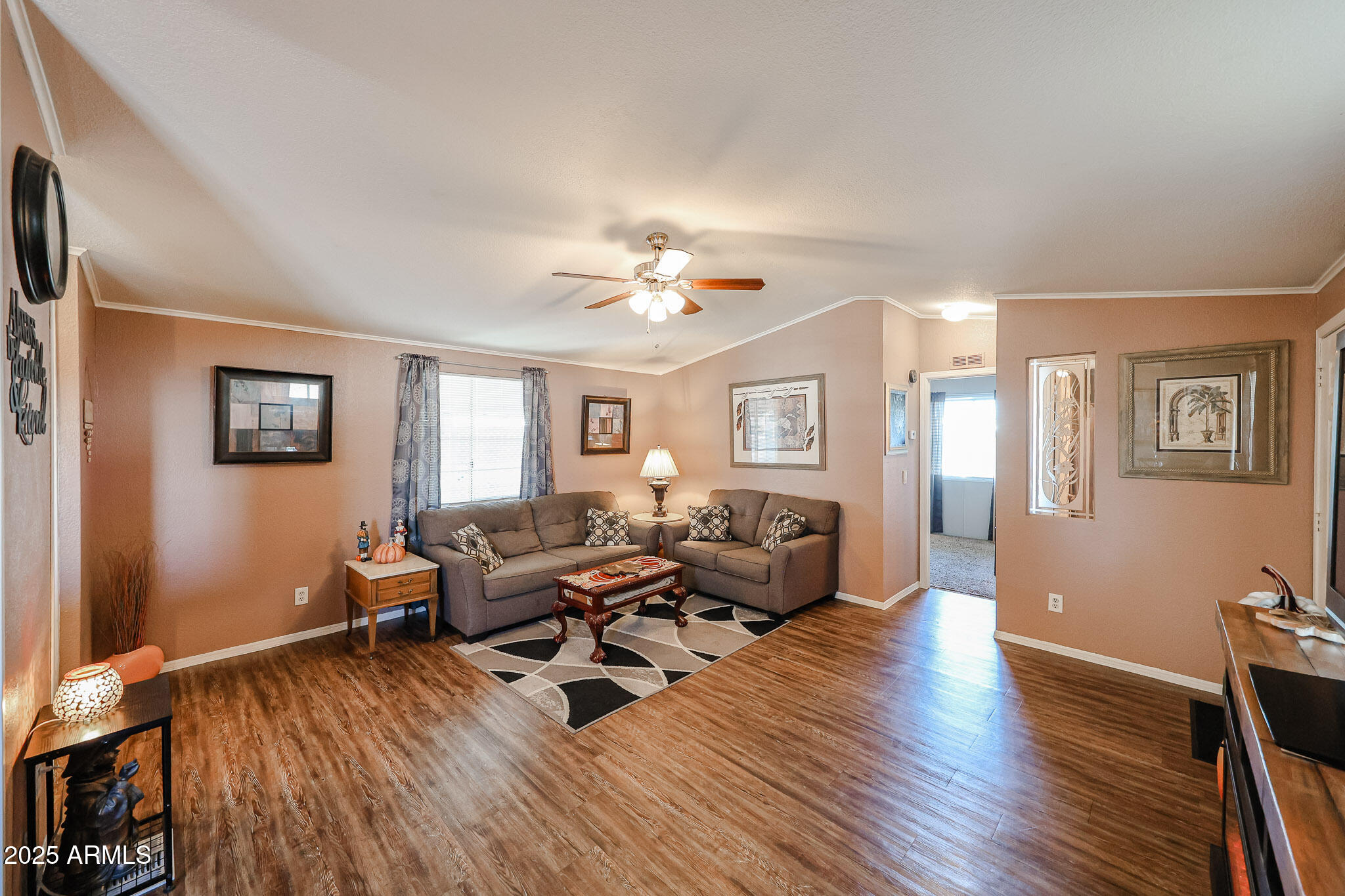 19602 North 32nd Street, Unit 32 Phoenix, AZ 85050 - Photo 11 of 37 a living room with furniture and a wooden floor