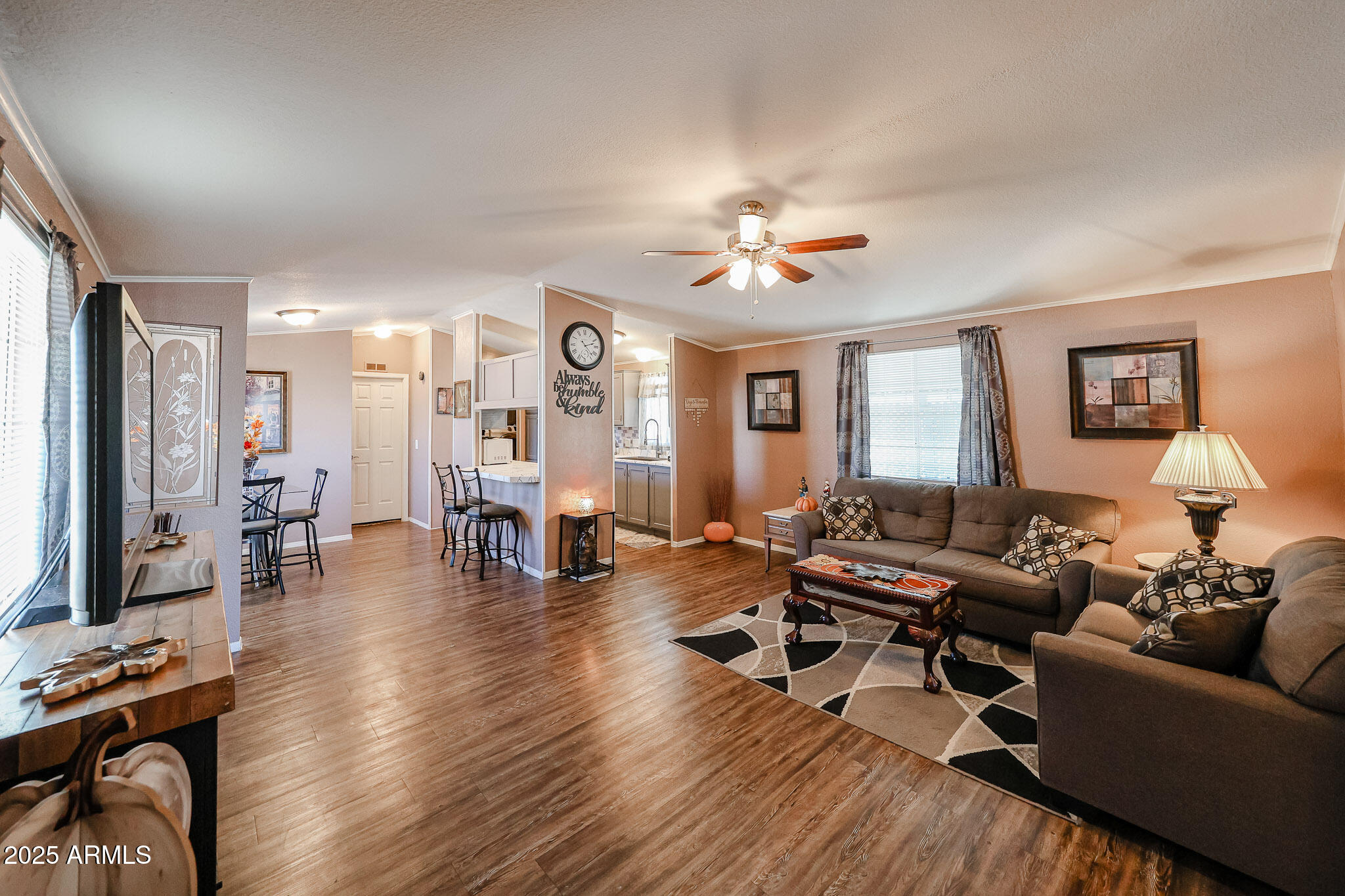 19602 North 32nd Street, Unit 32 Phoenix, AZ 85050 - Photo 12 of 37 a living room with furniture and wooden floor